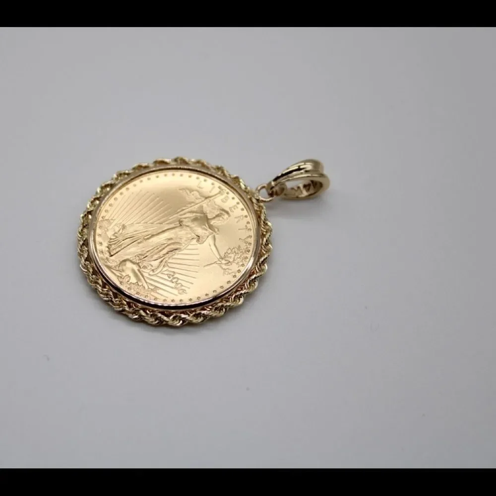 New 22k gold American Eagle 1/2 ounce coin mounted in 14k gold coin bezel